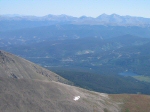 The lake down low is called Goose Pasture Tarn.  Off in the distance, from left to right, are Grays Peak and Torreys Peak, Mount Parnassus, and Pettingell Peak.